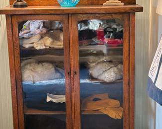 So sorry but this cabinet is no longer available.   The family decided to keep it; however, the mink and fox fur pieces and other contents are still up for grabs!