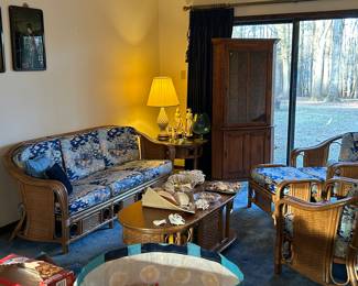 This is a 7 piece rattan set, a complete living room of furniture, in beautiful condition!  Couch, 2 glass top end tables, two comfy chairs and an ottoman!