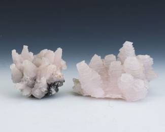 Two Specimens of Pink Calcite on ManganeseRich Matrix