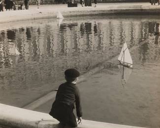 2399
Josef Vorisek
(1902-1980)
"Boy with Sailboat, Luxembourg Gardens, Paris," 1949
Gelatin silver print on paper
Dated 1949, and inscribed with a poem in French in blue ink, all verso
Sight: 12.75" H x 11" W
Estimate: $200 - $300