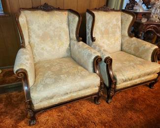 Pair of upholstered wingback armchairs