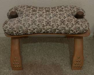 Camel saddle ottoman.