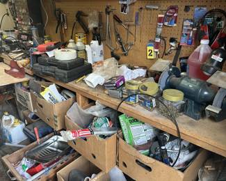 Assorted tools painting supplies, extension cords, and do it yourselfer supplies.