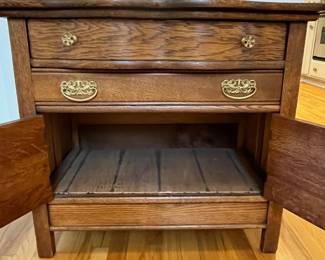 R24 - $85. Antique Cabinet. Drawers slide and doors open. Measures 32" wide x 19.25" deep x 29" tall.