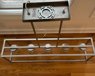 R15 - $50. Pendant Light. Measures 41" wide x 8.5" deep x 35" tall. Brushed Nickel. Works just switched out for a different style.