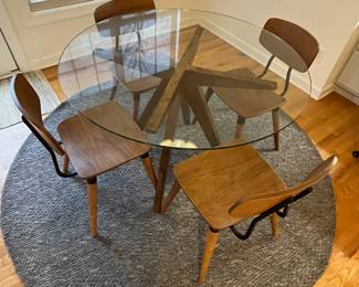 R36 - $600 SET. CB2 Table Measures 4' across x 30.25" tall. 4 Vega Dining chairs in very good vintage condition! Purchased over 20 years ago at a boutique furniture store in CT. Glass has some minor scratches from use but very good condition.