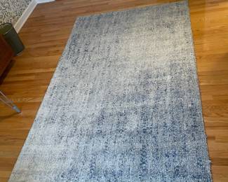 R49 - $150. West Elm Distressed Foliage Rug. Measures 5' x 8'.