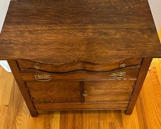 R24 - $85. Antique Cabinet. Drawers slide and doors open. Measures 32" wide x 19.25" deep x 29" tall.