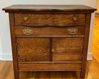 R24 - $85. Antique Cabinet. Drawers slide and doors open. Measures 32" wide x 19.25" deep x 29" tall.