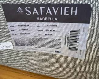 R39 - $50. 7' Round Wool Safavieh "Marbella" Rug. Does show some signs of wear but lots of life left!