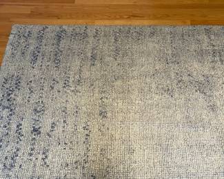 R49 - $150. West Elm Distressed Foliage Rug. Measures 5' x 8'.