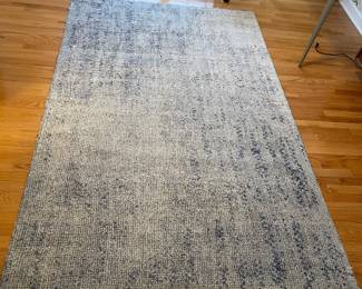 R49 - $150. West Elm Distressed Foliage Rug. Measures 5' x 8'.