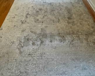 R42 - $60. Safavieh "Valencia" 9' x 12' area rug. Polyester. Had a king bed on top so there is more wear around the edges than the middle.