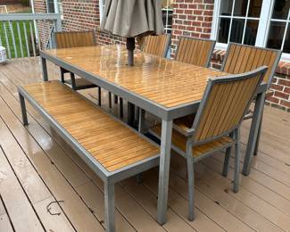 R58 - $450. Crate & Barrel Alfresco Patio Table with 5 Chairs and Bench. Includes Proshade 3 Tier Patio Umbrella with stand. Measures 79" long x 35.5" wide x 29.5" tall. The hole was made a bit bigger for the new umbrella by the owners. See photo.