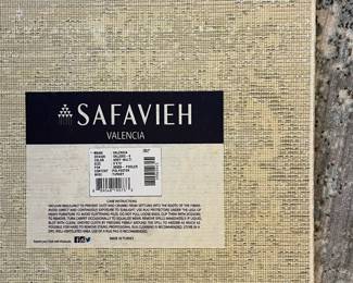 R42 - $60. Safavieh "Valencia" 9' x 12' area rug. Polyester. Had a king bed on top so there is more wear around the edges than the middle.