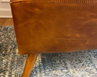 R27 - $175. Huxley Mid Century Style Armless Chair. From World Market (Retail $599) Needs leather conditioner but no holes / rips / tears. Measures 31.5" wide x 30.25" deep x 30" tall.