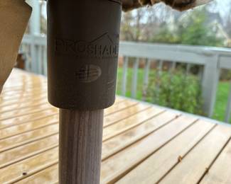 R58 - $450. Crate & Barrel Alfresco Patio Table with 5 Chairs and Bench. Includes Proshade 3 Tier Patio Umbrella with stand. Measures 79" long x 35.5" wide x 29.5" tall. The hole was made a bit bigger for the new umbrella by the owners. See photo.