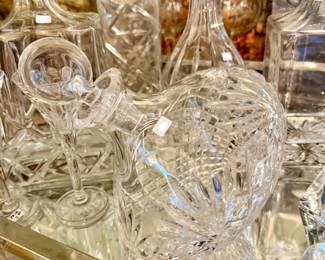 Lots of beautiful crystal decanters.