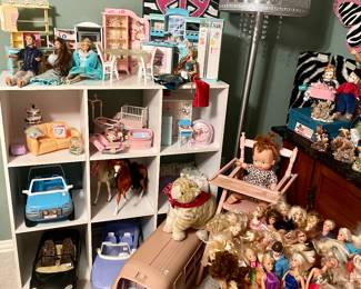 Lots of Barbies and Barbie furniture.