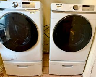 Samsung Steam Washer and Dryer frontloader with base.