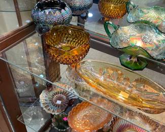 Curio Cabinet Filled with Fenton Carnival Glass Assorted Styles and Colors, Crystal Pitchers
