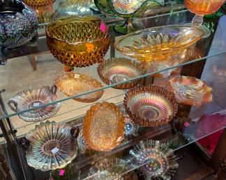 Curio Cabinet Filled with Fenton Carnival Glass Assorted Styles and Colors, Crystal Pitchers