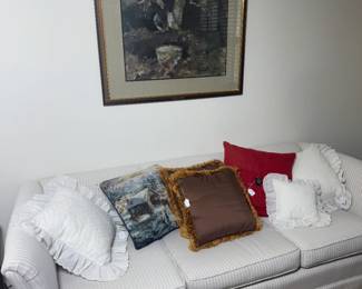 striped 3 seat sofa and decorative pillows