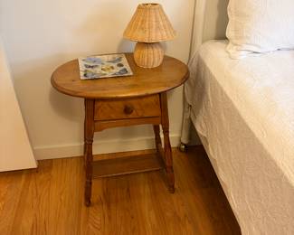 $60 Oval wood side table with shelf and one drawer. 15”d x 23”w x 26”h. Available for online and in person purchase.