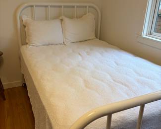 $80 White enameled metal frame full bed and mattress. 50”w x 34.5”h footboard and 48”h headboard. Available for online and in person purchase 
