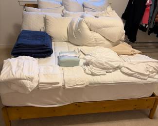 $120 Wood frame queen bed and mattress. 61”w x 35”h. Available for online and in person purchase.  Bedding for in-person shopping only.
