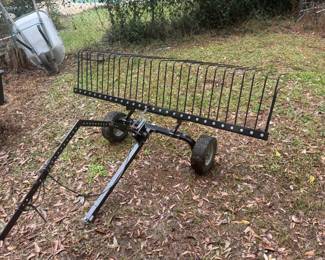Pull behind garden rake