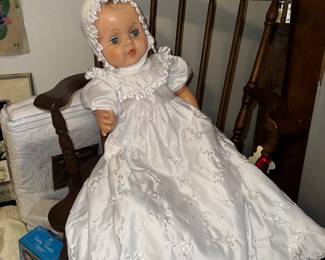 Vintage doll wearing vintage christening gown