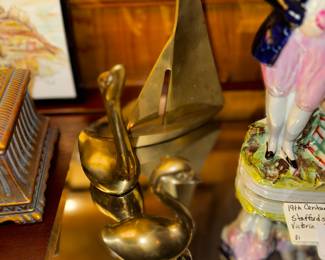 Brass ducks and boat