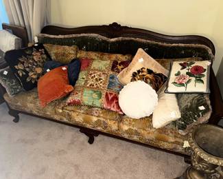 Antique cane back sofa. Throw pillows sold separately