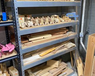 Wood toy cars, some finished and some not