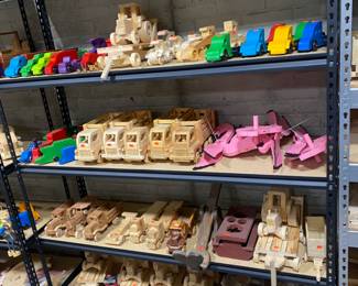 Wood toy cars, some finished and some not