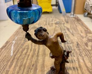 $125 Victorian-era cherub oil lamp with blue shade. 