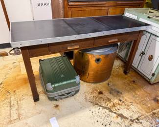 Vintage industrial work table with wood frame and metal top. Price $250