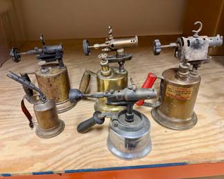 Lot of vintage and antique brass blowtorches. Steam punk decor