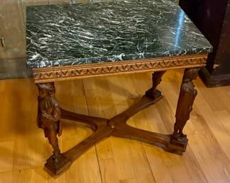 $650 - Antique American Empire-style mahogany carved side table with carved American Soldier legs and pie crust edge. With antique Green Marble Top.