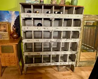 $375 - Antique wooden cubby storage unit, possibly an old hardware store display or soda crate rack.