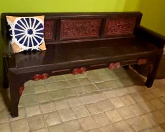 $800 - Chinese carved wooden bench with red accents. 