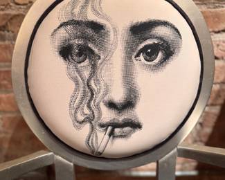 Lacquered Wood Frame Arm Chair. Round Back Upholstered in Piero Fornasetti Fabric Teme e Variation N. 81: Smoking Face of Opera Singer Lina Cavalieri. Measures 22" W with 19" Seat Height. Photo 2 of 2. 