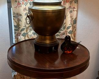 brass lamp and mahogany drum table