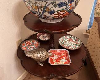 mahogany double table and Asian pottery