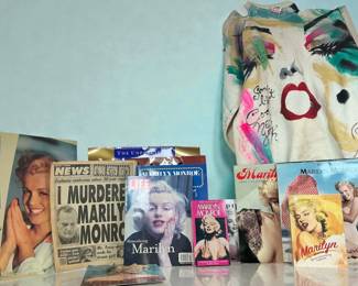 Uniquely painted Marilyn Monroe sweatshirt paired with periodicals and other items