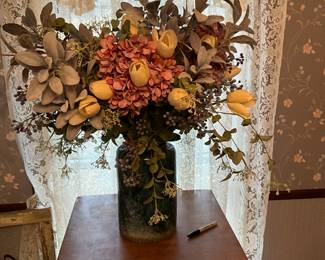 Lovely artificial flowers in vintage urn!