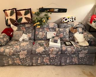 Sofa with lots of other items