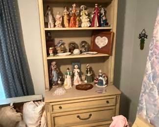 2nd bedroom - chest with shelves - lots of dolls & collectibles 