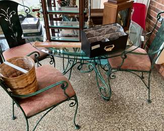 Glass top patio table with 4metal chairs - all chairs have cushioned seats 